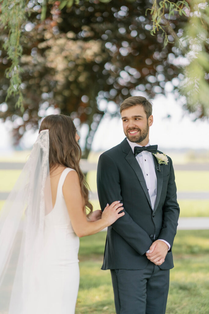 Groom sees his bride for the first time that day at their first look