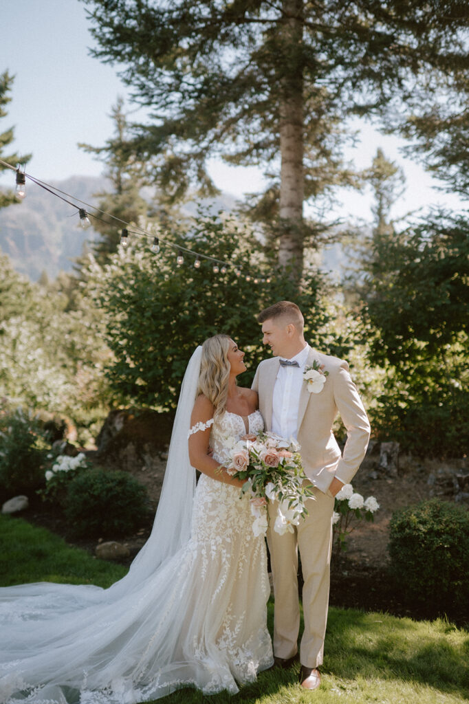 Bride and groom sharing a private moment at Cape Horn Estate's lush garden wedding venue